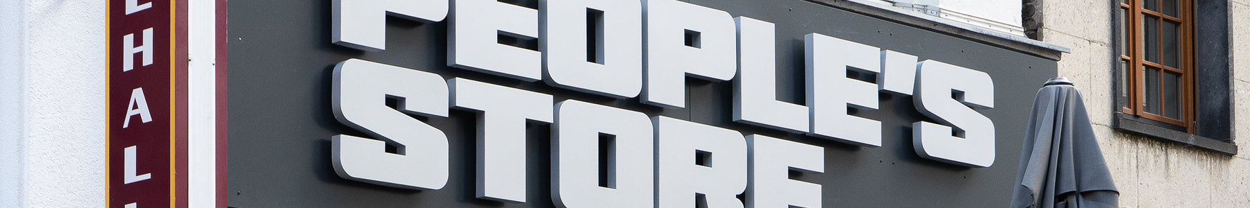 Exterior view of People's Store in Cologne featuring signage for top BMX brands and streetwear at new Eigelstein location