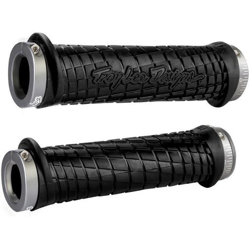 Pair of black ODI MTB grips with Troy Lee Designs logo and lock-on clamps for secure mountain bike handlebar grip