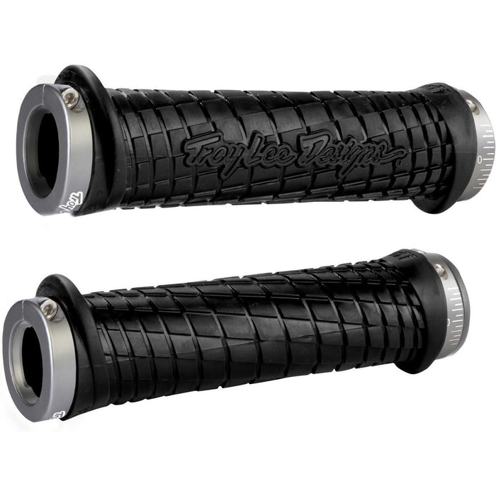 Pair of black ODI MTB grips with Troy Lee Designs logo and lock-on clamps for secure mountain bike handlebar grip
