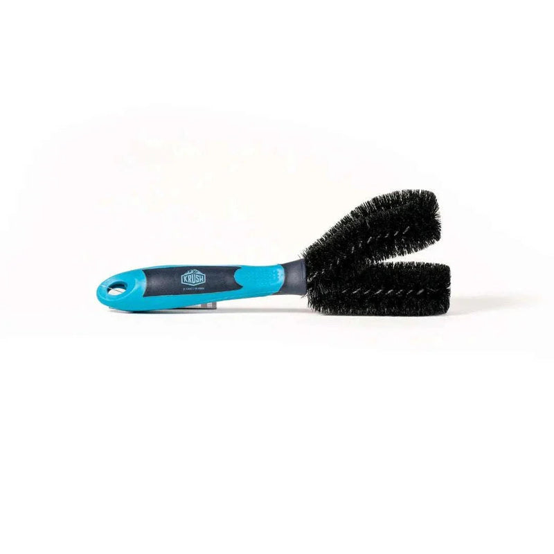 KRUSH K#2 BRUSH with blue handle and black bristles isolated on white background