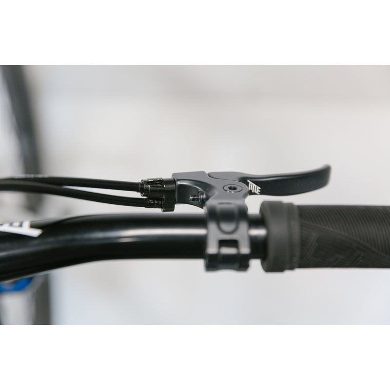 Close-up of black MTB G1 Brake Cable connected to a Title G1 brake lever on a mountain bike handlebar