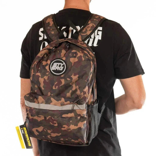 Camouflage STAY STRONG V3 ICON BACKPACK worn by person, featuring multiple compartments for organized storage and 17-inch laptop capacity.