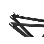 Close-up of black CRONUS Frame rear triangle with integrated chain tensioners and dropout mounts for dirt jump bike.