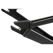 Close-up of black CRONUS Frame aluminum bike dropout with integrated chain tensioner and disc brake mount