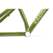 Close-up of green RADIO CRONUS Frame aluminum slopestyle bike frame showing welds and bottom bracket area