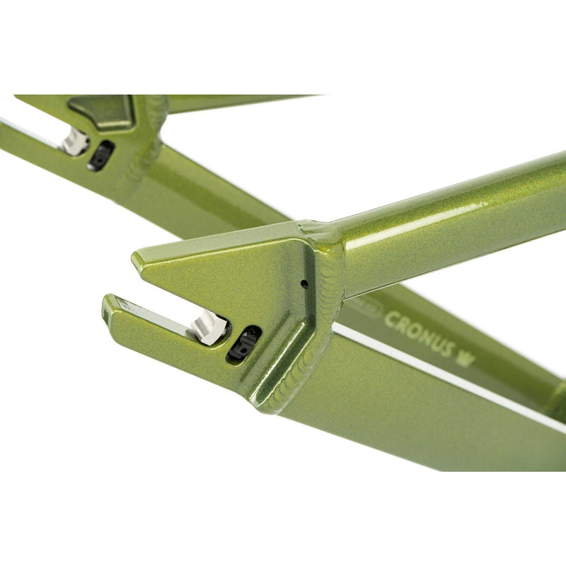 Close-up of green aluminum CRONUS Frame dropout with integrated chain tensioner for dirt jump bike