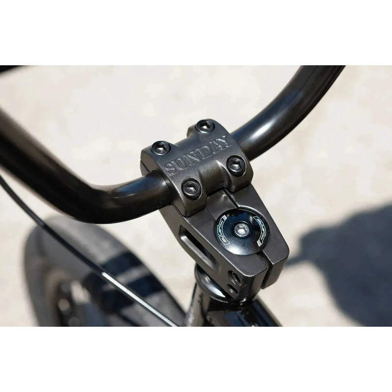Close-up of black Sunday Scout 20" BMX bike handlebar and stem with Sunday brand logo