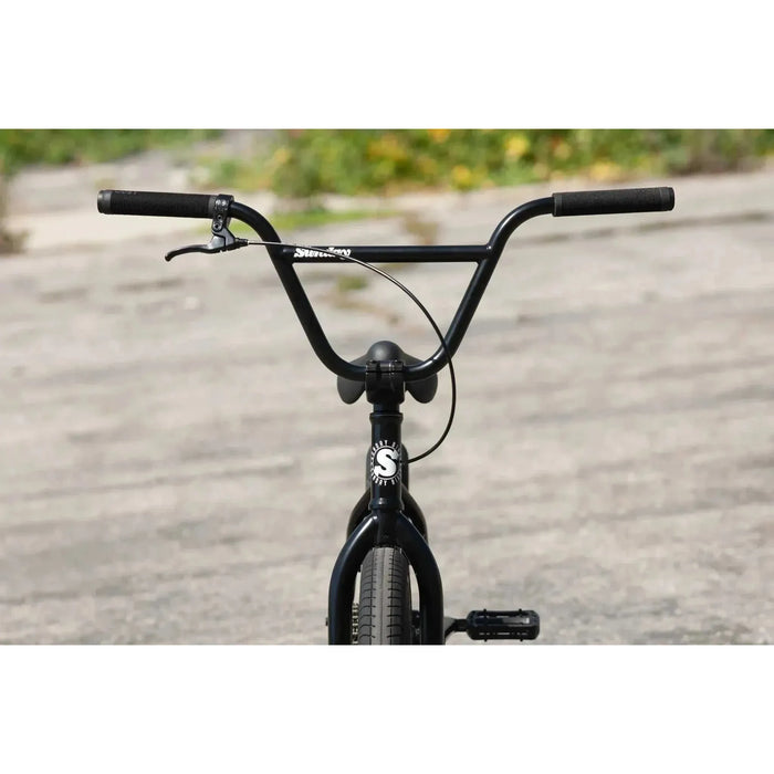 Front view of Sunday Scout 20" BMX bike with black frame, Odyssey Springfield brakes, and signature grips.