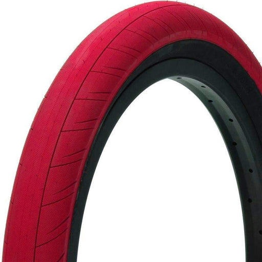 Red Primo Churchill tire with durable tread and black inner rim for enhanced traction and stability.