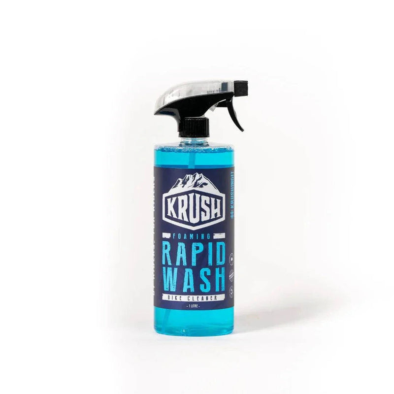 Bottle of KRUSH RAPID WASH foaming bike cleaner with blue liquid and spray nozzle