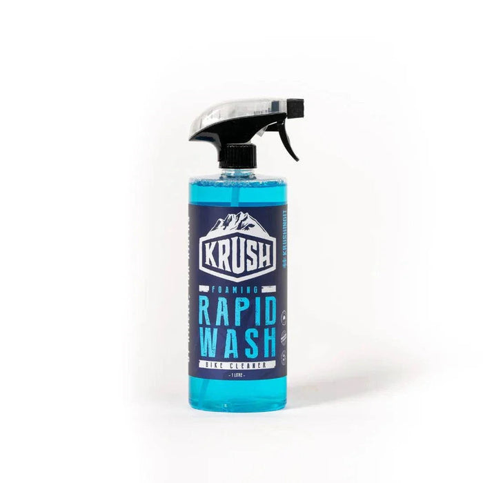 Bottle of KRUSH RAPID WASH foaming bike cleaner with blue liquid and spray nozzle