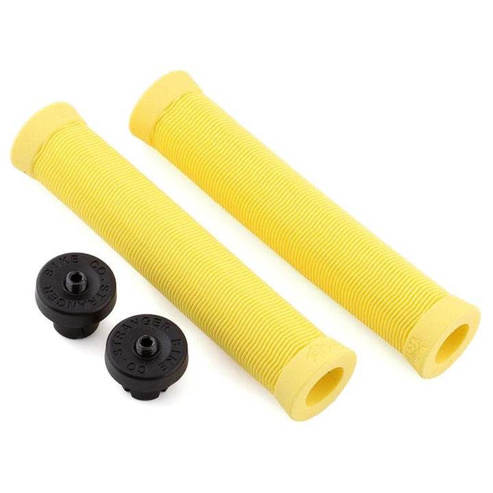 Yellow Stranger Piston SuuuperSoft rubber grips with wavey ribbed pattern and black plugz bar ends