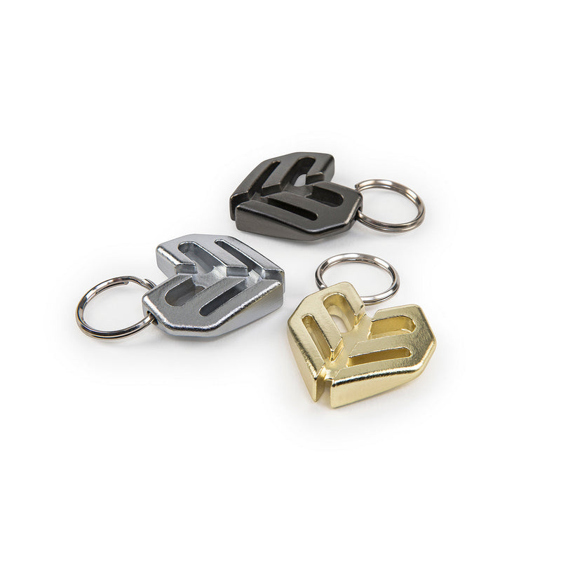 ÉCLAT SPOKE KEY CHAIN in black, silver, and gold, made from durable heat-treated chromoly.