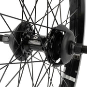 ÉCLAT TRIPPIN/CORTEX EVO CS cassette rear wheel with Cortex Evo hub, black steel spokes, and nylon hub guards.