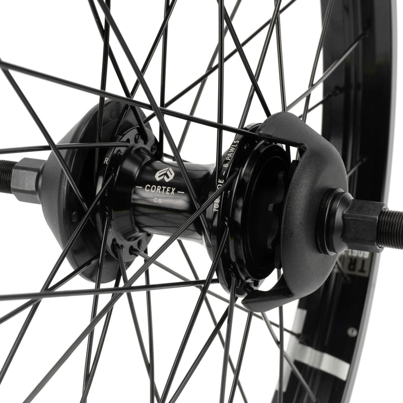 ÉCLAT TRIPPIN/CORTEX EVO CS cassette rear wheel with Cortex Evo hub, black steel spokes, and nylon hub guards.