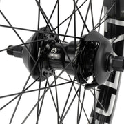 ÉCLAT TRIPPIN/CORTEX EVO FC freecoaster rear wheel with black spokes and nylon hub guards.