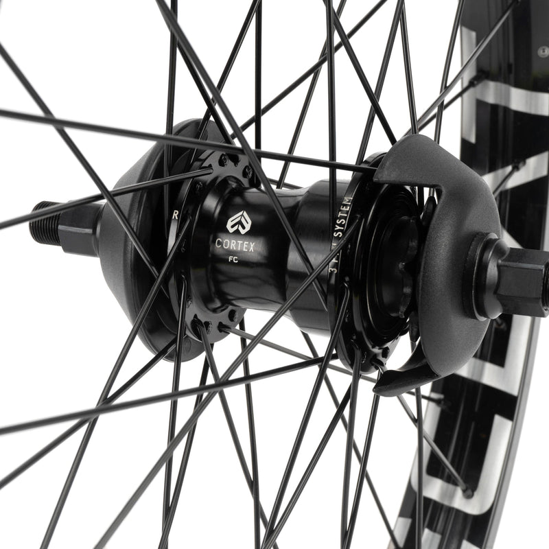 ÉCLAT TRIPPIN/CORTEX EVO FC freecoaster rear wheel with black spokes and nylon hub guards.