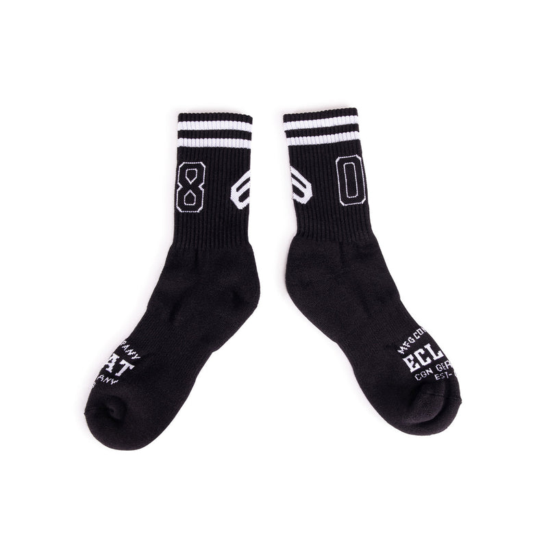 Pair of black ÉCLAT 08 socks with white stripes and number design, made from cotton blend materials