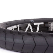Close-up of ÉCLAT DECODER TIRE 60TPI street BMX tire with micro knurling and grind-resistant sidewall protection.