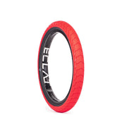 Red ÉCLAT DECODER TIRE with low-profile tread and grind-resistant sidewall for BMX street and ramp riding.