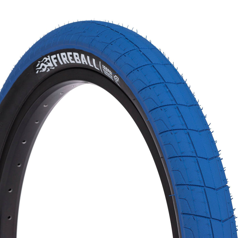 Blue ÉCLAT Fireball Tire with grind-resistant tread and reinforced sidewall.