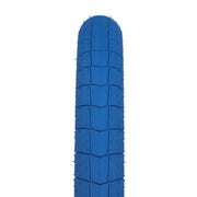 ÉCLAT FIREBALL TIRE 2.40" blue street BMX tire with tread pattern and reinforced sidewalls.