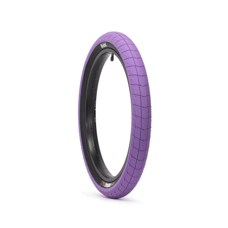 ÉCLAT FIREBALL TIRE with purple tread, designed for street riders, featuring 2.40" width, puncture-resistant Pangolin sidewall, Cobweb layer for durability, and micro knurling for traction.