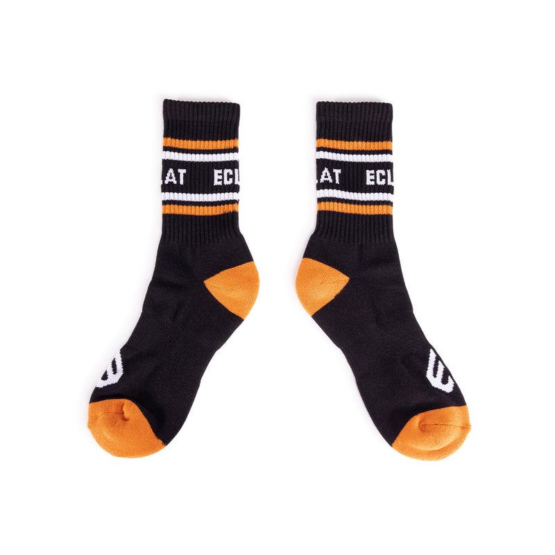 Pair of black and orange ÉCLAT ICON SOCKS with cotton blend and branded design