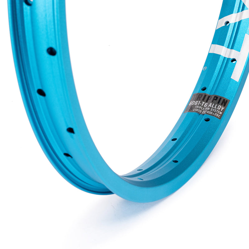 Blue ÉCLAT TRIPPIN RIM with triple pin design and 38mm width.