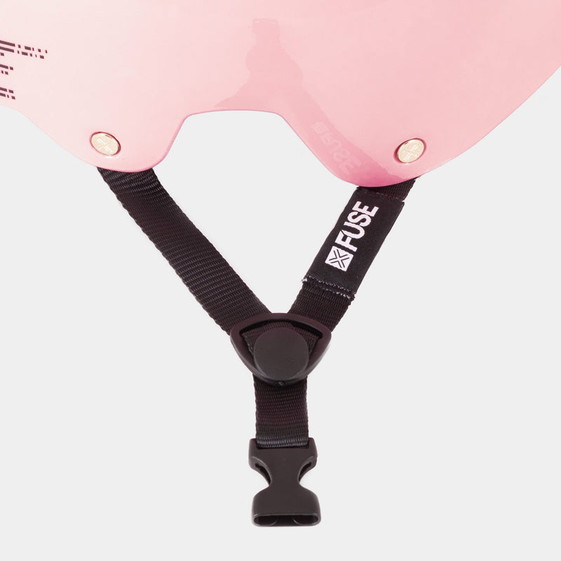 Glossy pink FUSE ALPHA helmet with quick release strap and high impact ABS shell.