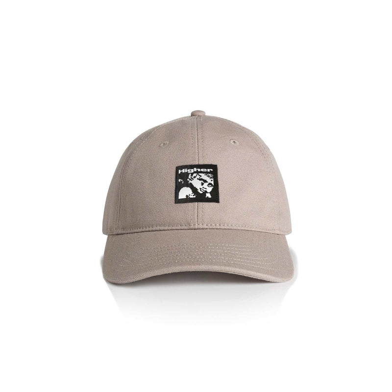 Beige HIGHER CRYPT CAP with six-panel design, curved peak, and woven art label on front