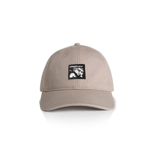 Beige HIGHER CRYPT CAP with six-panel design, curved peak, and woven art label on front