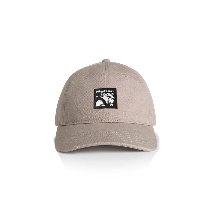 Beige HIGHER CRYPT CAP with six-panel design, curved peak, and woven art label on front