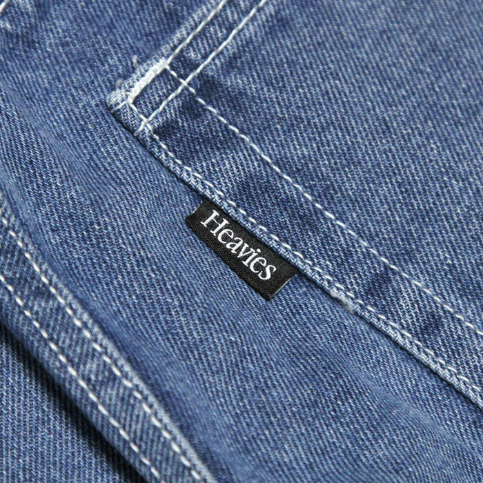 Blue denim fabric of HEAVIES BERN DOUBLE KNEE JEANS with Heavies label.