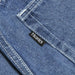 Blue denim fabric of HEAVIES BERN DOUBLE KNEE JEANS with Heavies label.