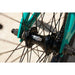 Close-up of black Sunday Primer 20-inch sealed cassette hub on teal bike frame with spokes and chain.