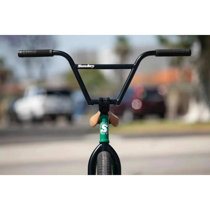 Front view of Sunday Forecaster BMX bike with black handlebars and green frame detailing