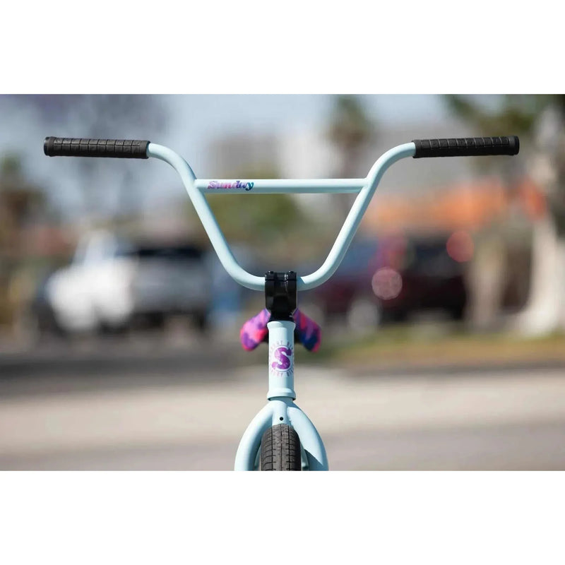 Front view of a matte sky blue SUNDAY FORECASTER ROSS 20" complete BMX bike with black grips and signature decals.