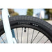 Close-up of Odyssey Path Pro tire and black rim on Sunday Forecaster Ross 20" chromoly bike in matte sky blue