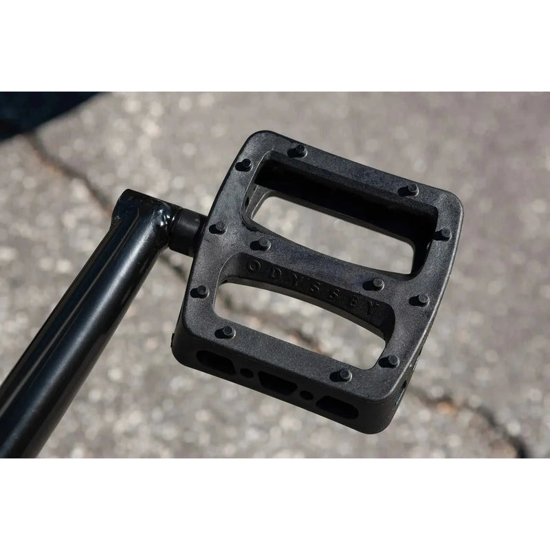 Close-up of black Odyssey Twisted Pro bike pedal on Sunday Forecaster BMX bike crankarm
