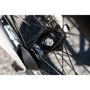 Close-up of Sunday Forecaster bike's black sealed front hub with logo and spokes detail