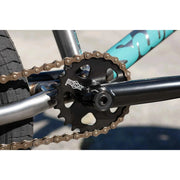 Close-up of Sunday Forecaster BMX bike sprocket and chain on chromoly frame with turquoise branding