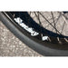 Close-up of Sunday Forecaster bike's black Odyssey Path Pro tire and Sunday Lightning rim with white branding