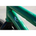 Close-up of green Sunday Forecaster bike frame with 100% chromoly label