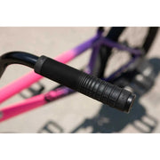 Close-up of black grip handle on Sunday Street Sweeper Jake Seeley signature BMX bike frame with matte hot pink to matte grape fade color.