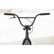Close-up of black Sunday Model C BMX bike handlebars and front fork with brake lever and cable attached