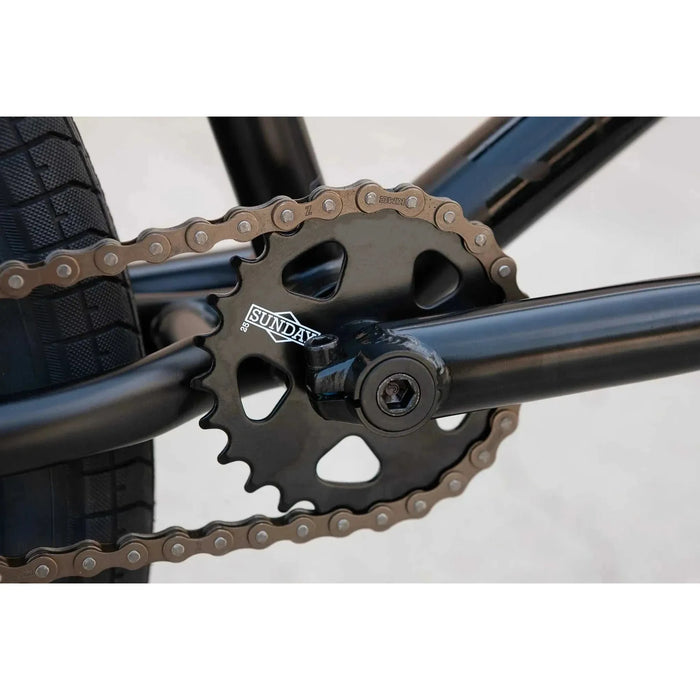 Close-up of Sunday Model C BMX bike black sprocket and chain on 24-inch frame.