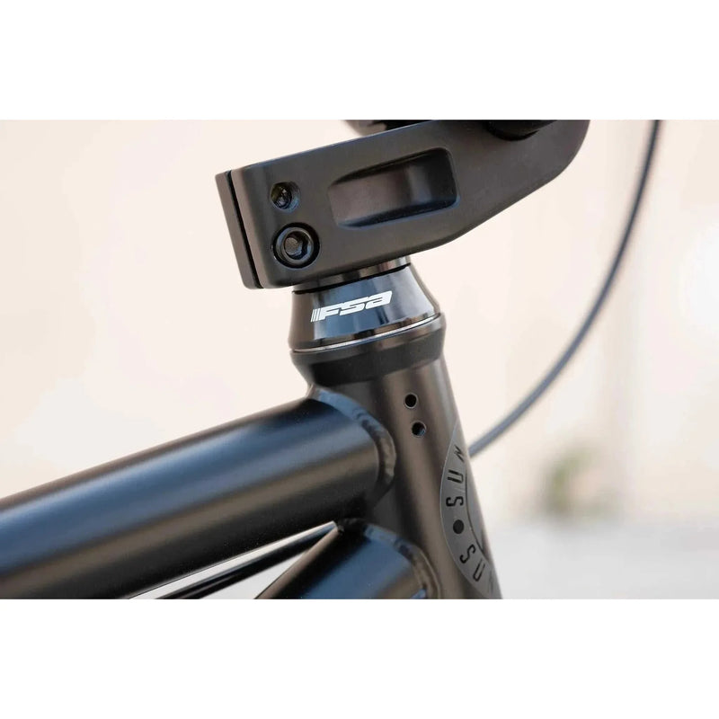 Close-up of the black Sunday Model C BMX bike frame with FSA conical headset and integrated welds.