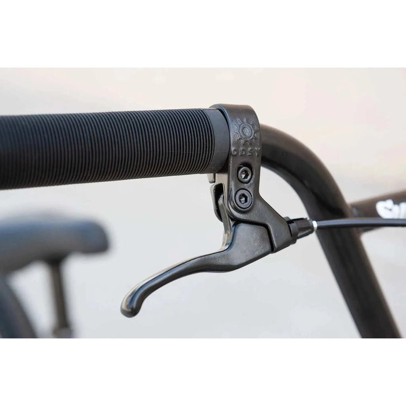 Close-up of black Sunday Model C BMX bike brake lever and handlebar grip