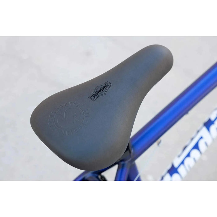 Close-up of the black Odyssey Monogram seat on the blue SUNDAY MODEL C 24" BMX bike.